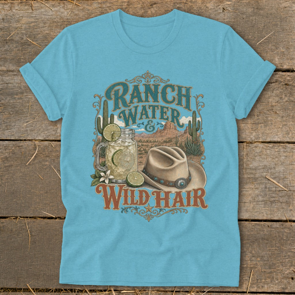 Light blue t-shirt with "Ranch Water & Wild Hair" text, drink, and cowboy hat graphic.