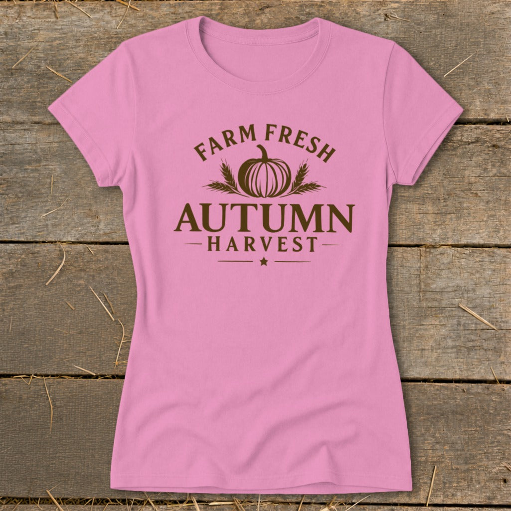 Pink t-shirt with brown "Farm Fresh Autumn Harvest" graphic and pumpkin.