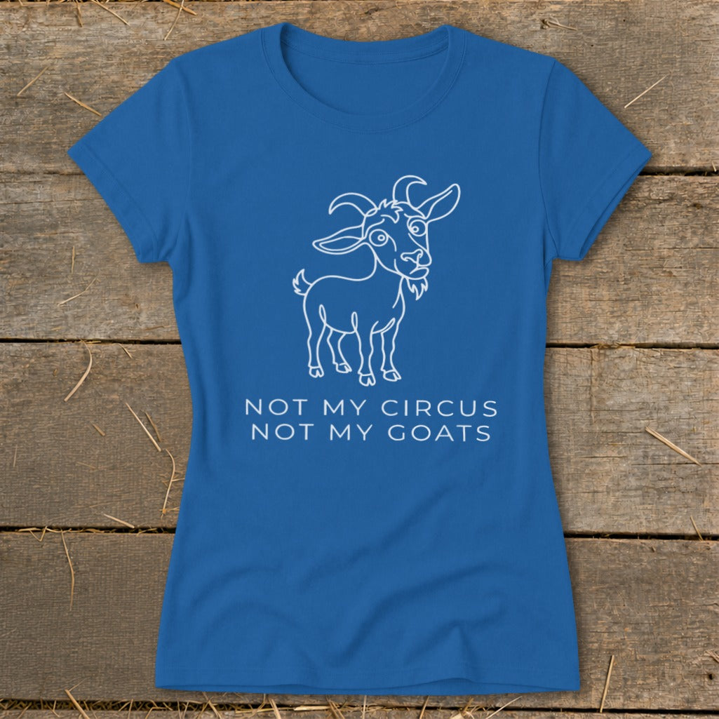 Blue t-shirt with white outline drawing of a goat and text "NOT MY CIRCUS NOT MY GOATS".
