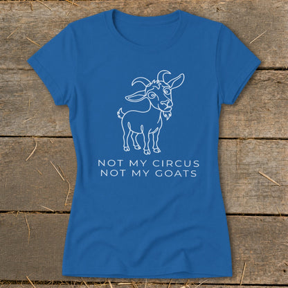 Blue t-shirt with white outline drawing of a goat and text "NOT MY CIRCUS NOT MY GOATS".