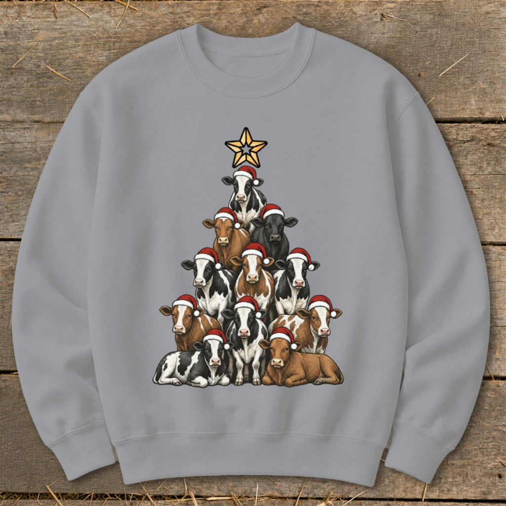Christmas tree made of cows wearing Santa hats, topped with a star.