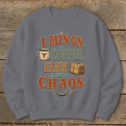 "I Run on Coffee, Hay, and Chaos" graphic on a grey sweatshirt.