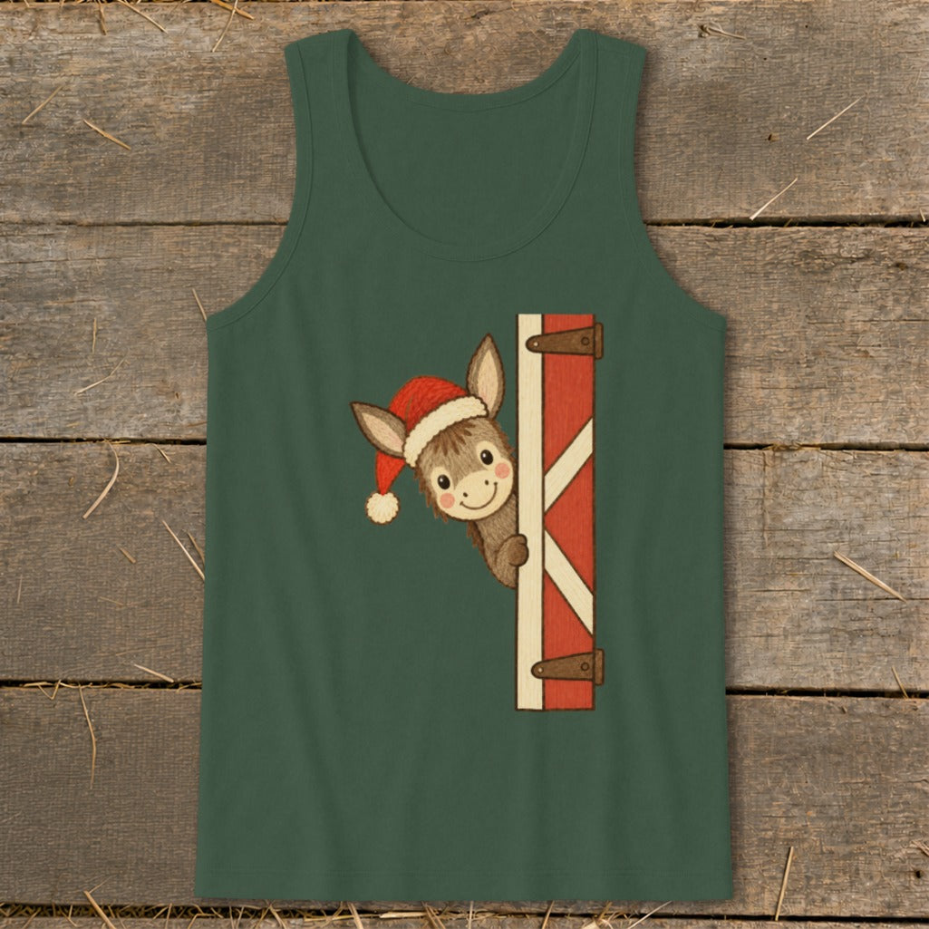 Christmas donkey wearing a Santa hat peeking around a barn door.