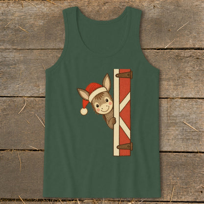 Christmas donkey wearing a Santa hat peeking around a barn door.
