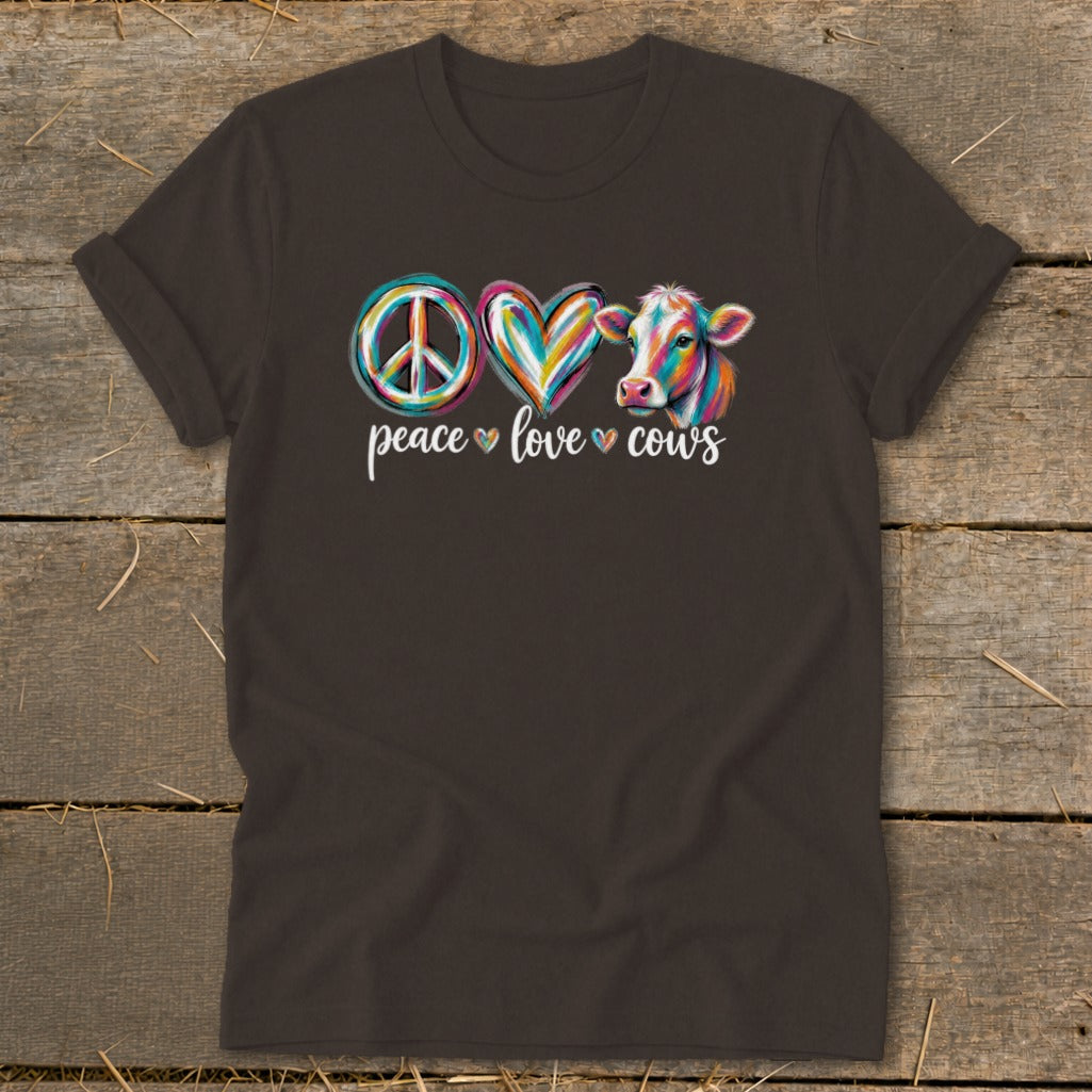 T-shirt with peace sign, heart, and cow graphic and "peace love cows" text.
