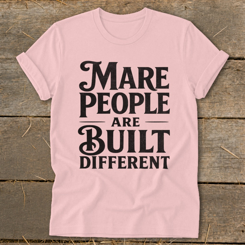 Pink t-shirt with black text "Mare People Are Built Different".