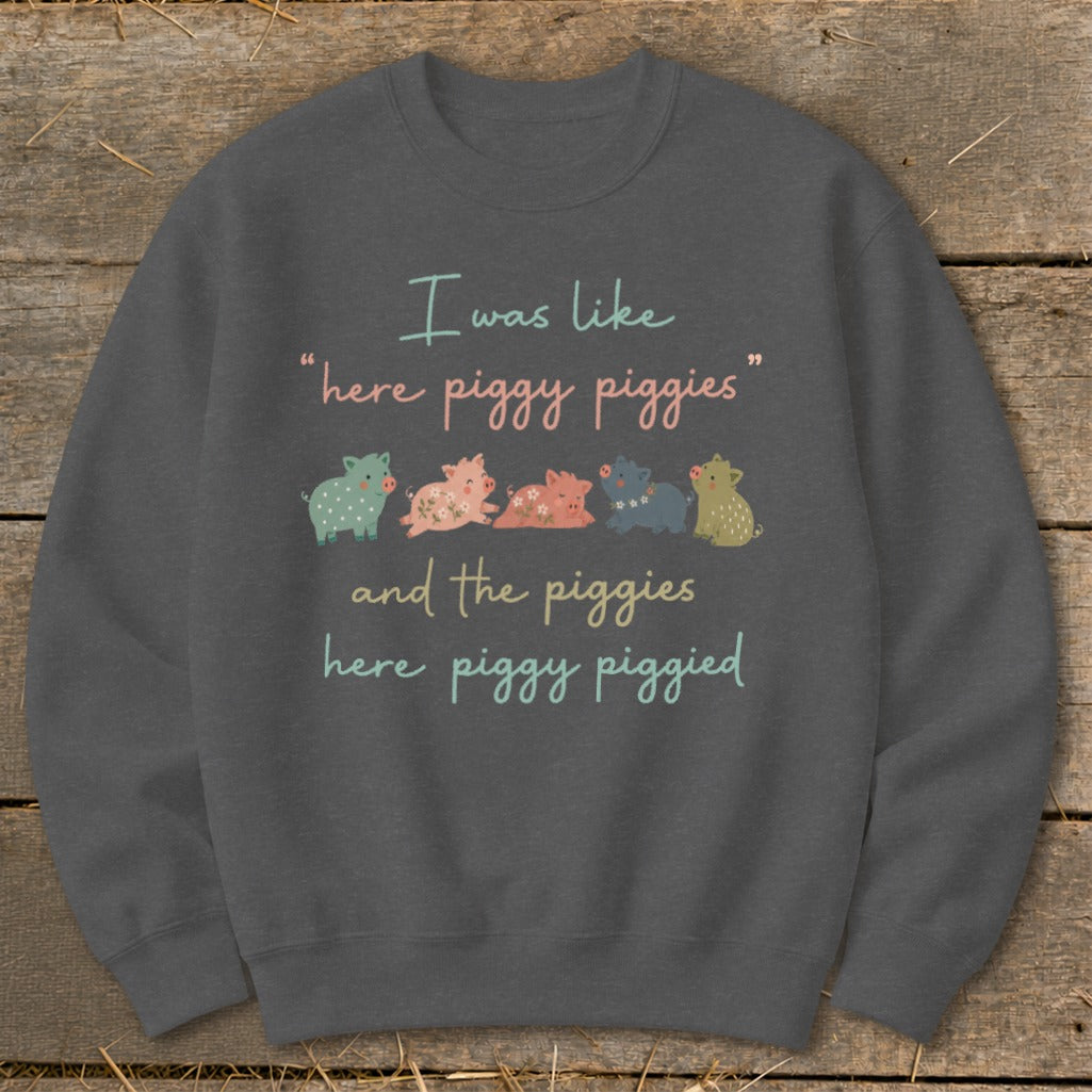Sweatshirt with text "I was like 'here piggy piggies' and the piggies here piggy piggied" and cartoon pigs.