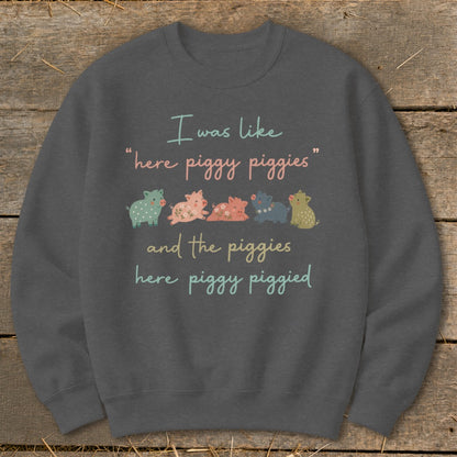 Sweatshirt with text "I was like 'here piggy piggies' and the piggies here piggy piggied" and cartoon pigs.