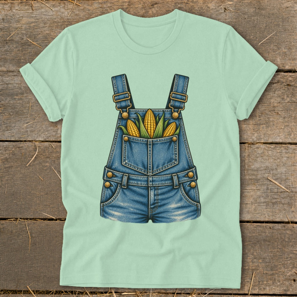 Light green t-shirt with a denim overalls graphic featuring three ears of corn.