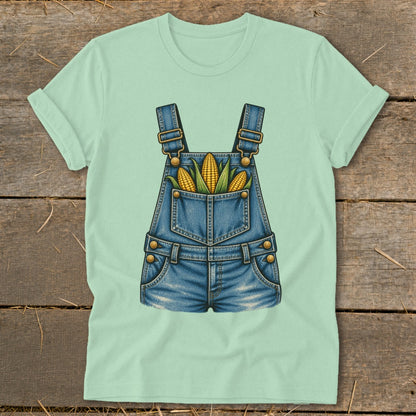 Light green t-shirt with a denim overalls graphic featuring three ears of corn.