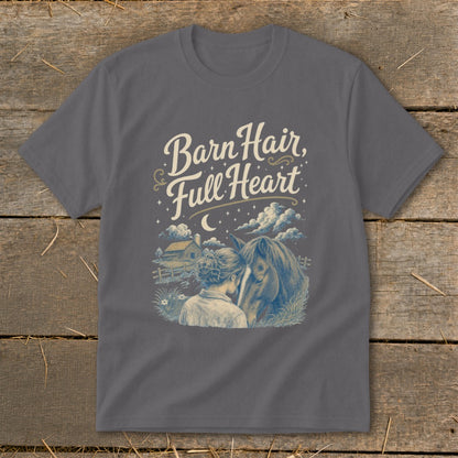 T-shirt graphic with text "Barn Hair, Full Heart" and illustration of a girl and horse.