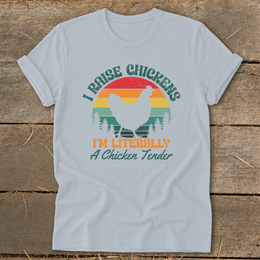 Light blue t-shirt with "I Raise Chickens I'm Literally A Chicken Tender" text and chicken graphic.