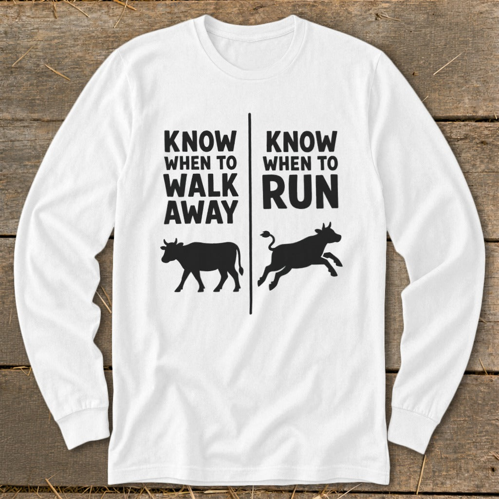 White long sleeve shirt with text "KNOW WHEN TO WALK AWAY" and a walking cow.