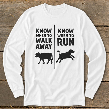 White long sleeve shirt with text "KNOW WHEN TO WALK AWAY" and a walking cow.