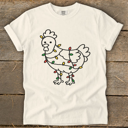 White t-shirt with a line drawing of a chicken wrapped in colorful Christmas lights.