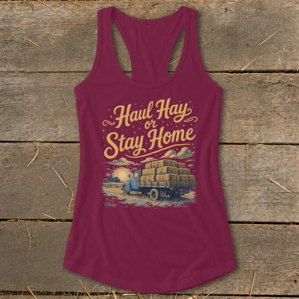 Burgundy tank top with "Haul Hay or Stay Home" graphic featuring a truck loaded with hay.