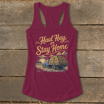 Burgundy tank top with "Haul Hay or Stay Home" graphic featuring a truck loaded with hay.