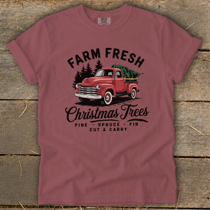 Red pickup truck with Christmas trees and text "Farm Fresh Christmas Trees".