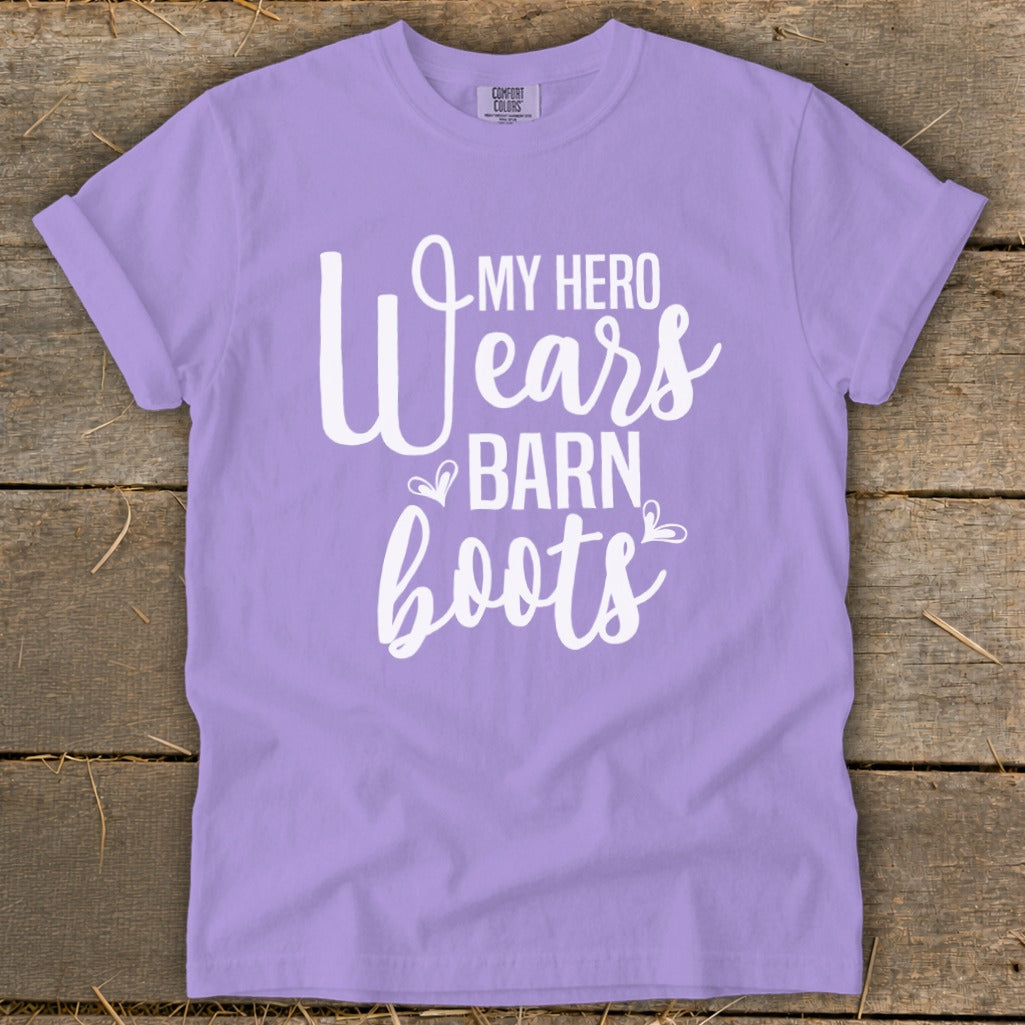 Purple t-shirt with white text reading "My Hero Wears Barn Boots".