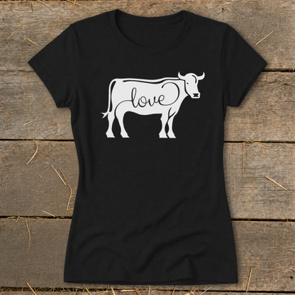 Black t-shirt with white cow outline design incorporating the word "love."