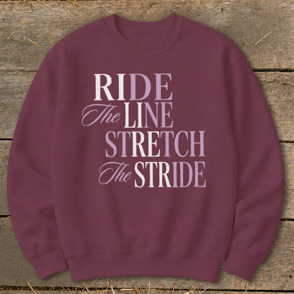 Maroon sweatshirt with "RIDE The LINE STRETCH The STRIDE" text in varying fonts and colors.