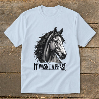 Light blue t-shirt with a black and white sketch of a horse's head and "IT WASN'T A PHASE" text.
