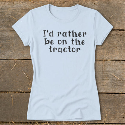 Light blue t-shirt with black text that reads "I'd rather be on the tractor".