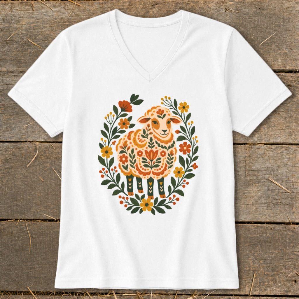 White v-neck t-shirt with a decorative floral sheep graphic.