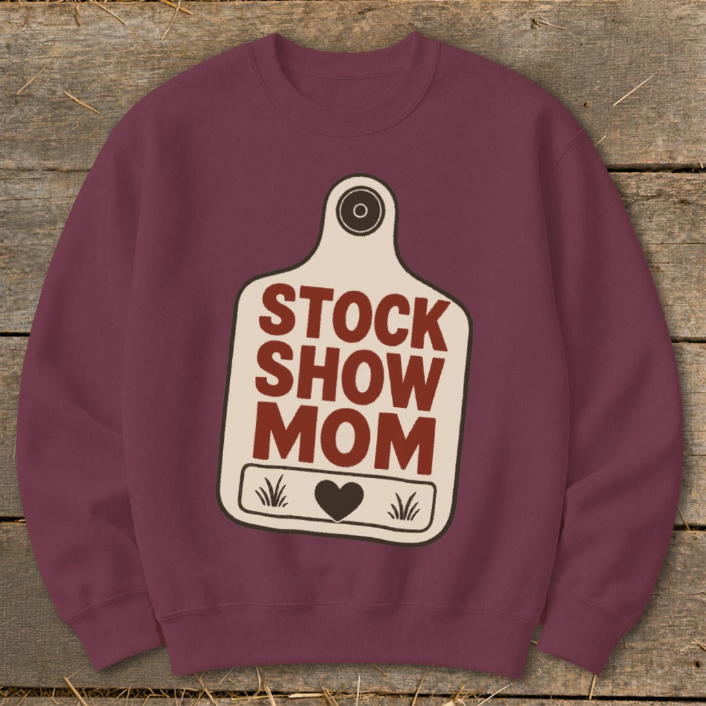 Maroon sweatshirt with a cream tag graphic that says "STOCK SHOW MOM" and a heart.