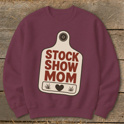 Maroon sweatshirt with a cream tag graphic that says "STOCK SHOW MOM" and a heart.