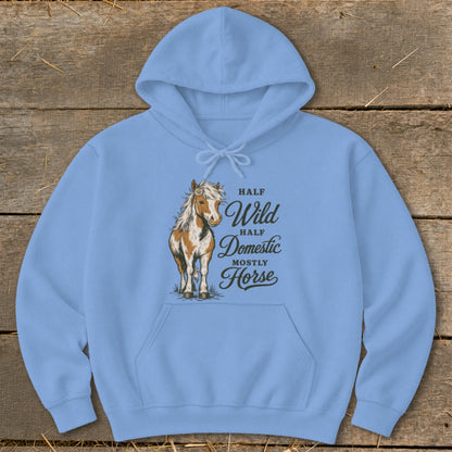 Light blue hoodie with a horse illustration and text: "Half Wild, Half Domestic, Mostly Horse."