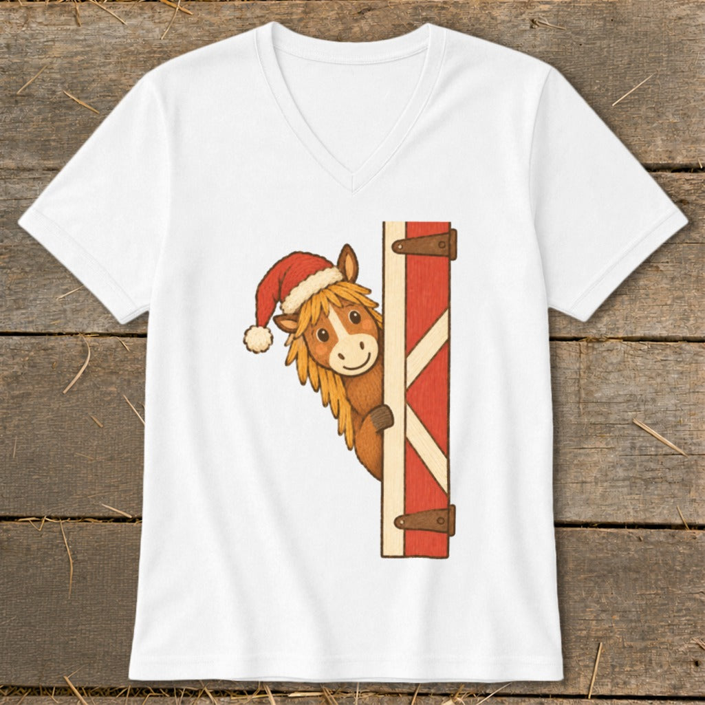 White t-shirt with a cartoon horse wearing a Santa hat peeking around a barn door.