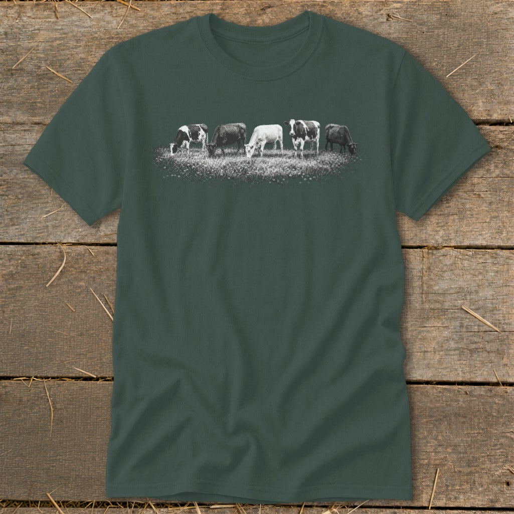Dark green t-shirt with a line of five grazing cows graphic across the chest.