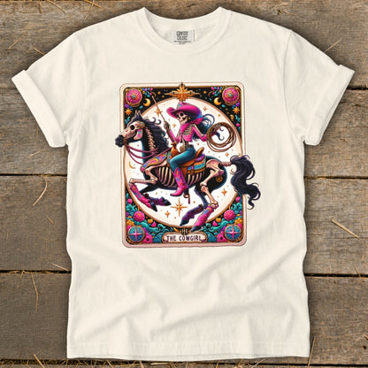 Skeleton cowgirl on horseback wearing a pink hat and boots, with lasso and text "The Cowgirl".