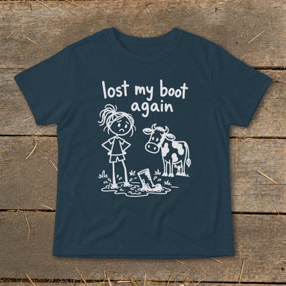 Dark blue t-shirt featuring white graphic of a sad girl, a cow, and text reading lost my boot again.
