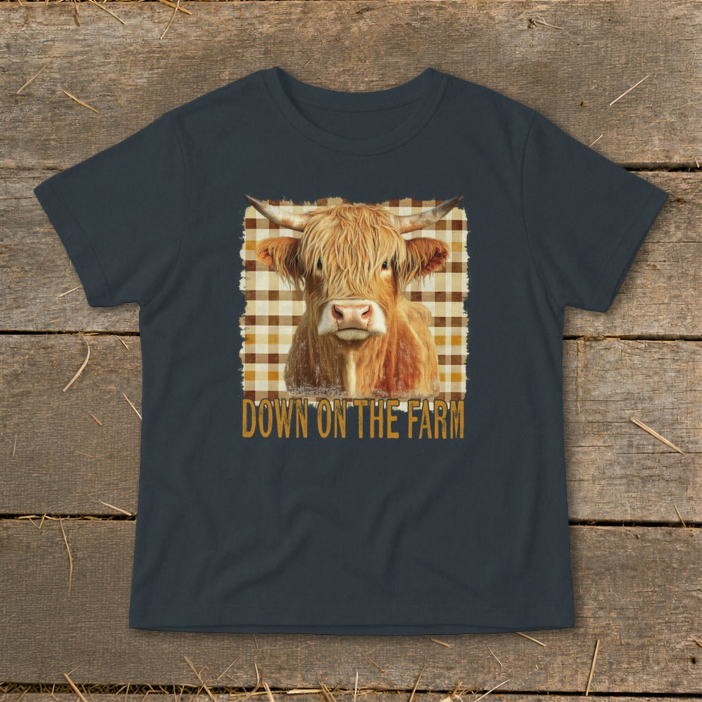 Highland cow portrait with text "DOWN ON THE FARM" on a t-shirt.